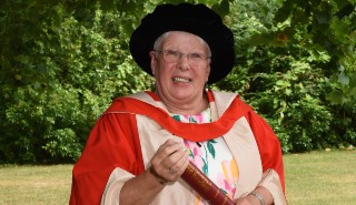 Dr Trisha Bennett with her Honorary Degree of Doctor of Letters at Summer Graduation 2022