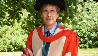Film director and producer Walter Salles with his Honorary Degree of Doctor of Letters, awarded at the University's summer 2022 Graduation