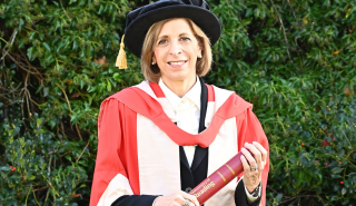 Stella Kyriakides holding her honorary degree