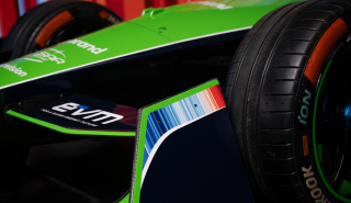 Climate stripes on the livery of the Envision car