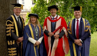 Left to right: Chancellor Paul Lindley, Dr Claire Collins, Simon Carter and Professor Robert Van de Noort in their ceremonial robes