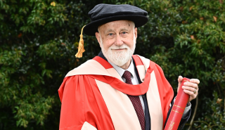 Martin Andrews holding his honorary degree