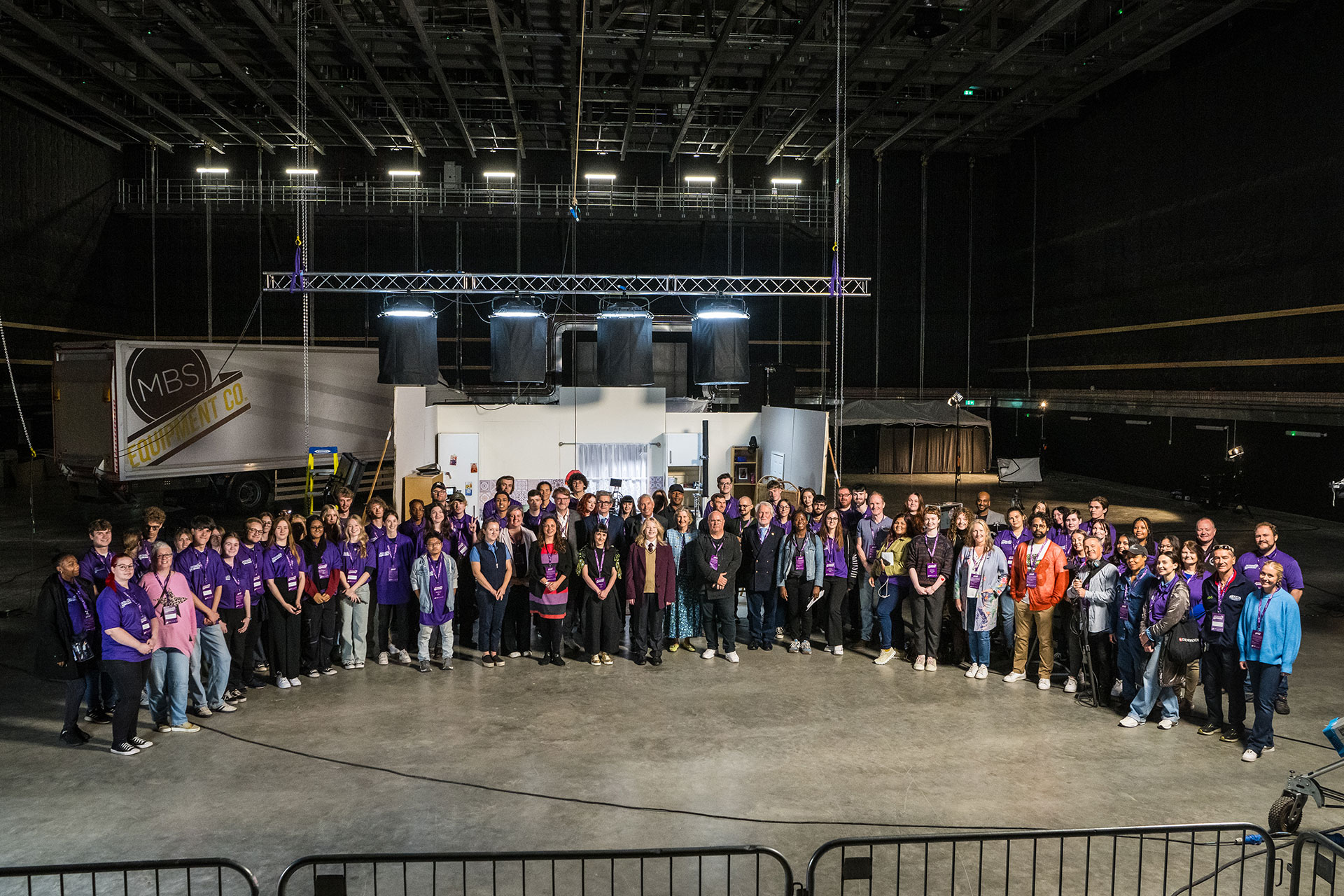 A group shot of the Screen Berkshire project partners and film crew from the launch event, against a film set backdrop
