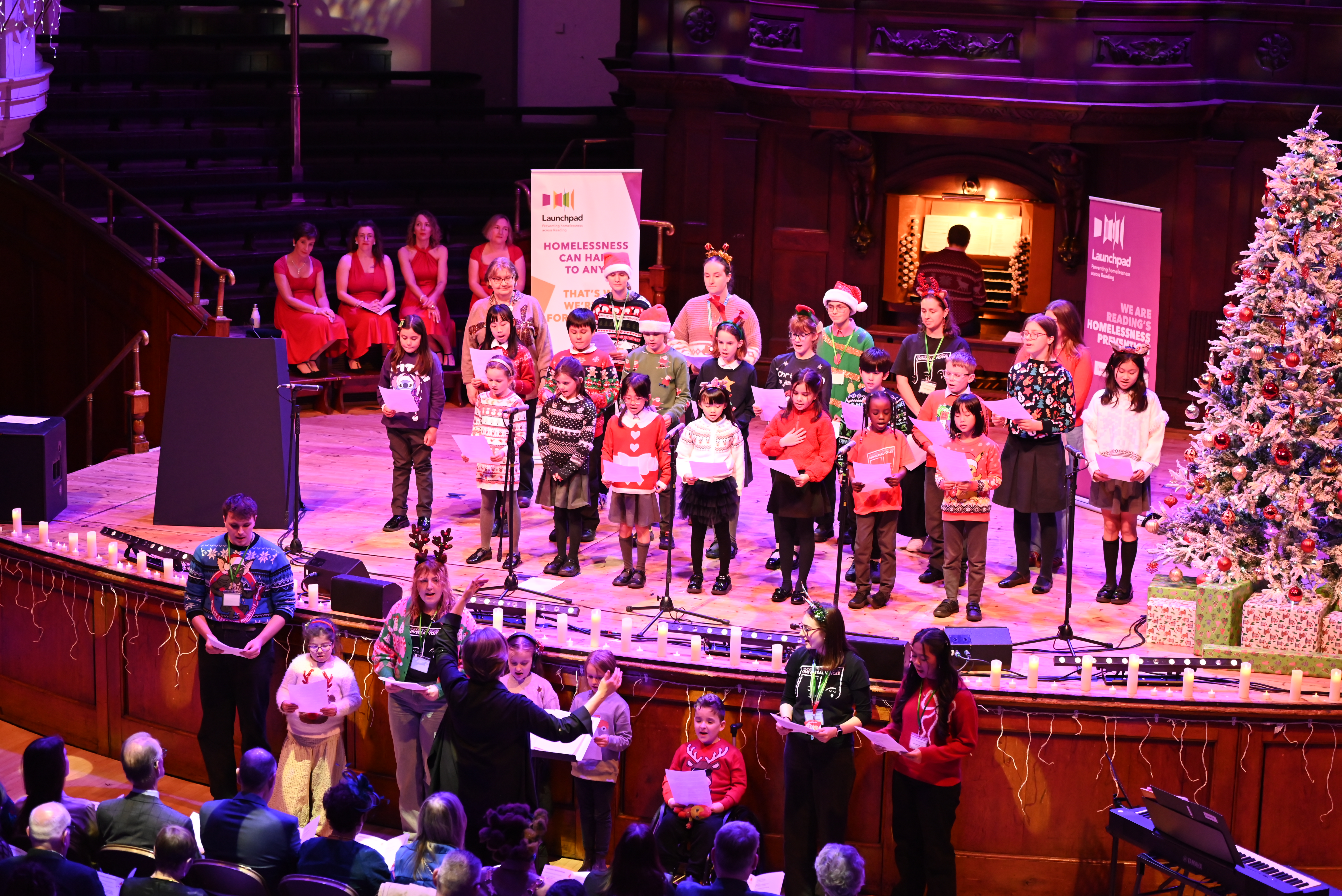 A children's choir performing on stage