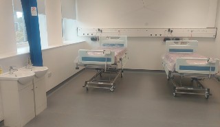 Hospital beds in a room of the clinical training suite, designed to mimic a real hospital ward