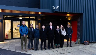 Ofgem Chief Executive Jonathan Brearley and Chair Mark McAllister with colleagues outside the Art building, where 180 solar panels were recently instalkled