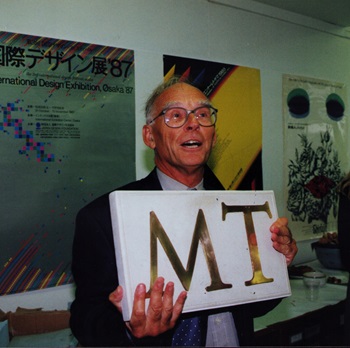 Professor Michael Twyman holding a gift at his retirement party