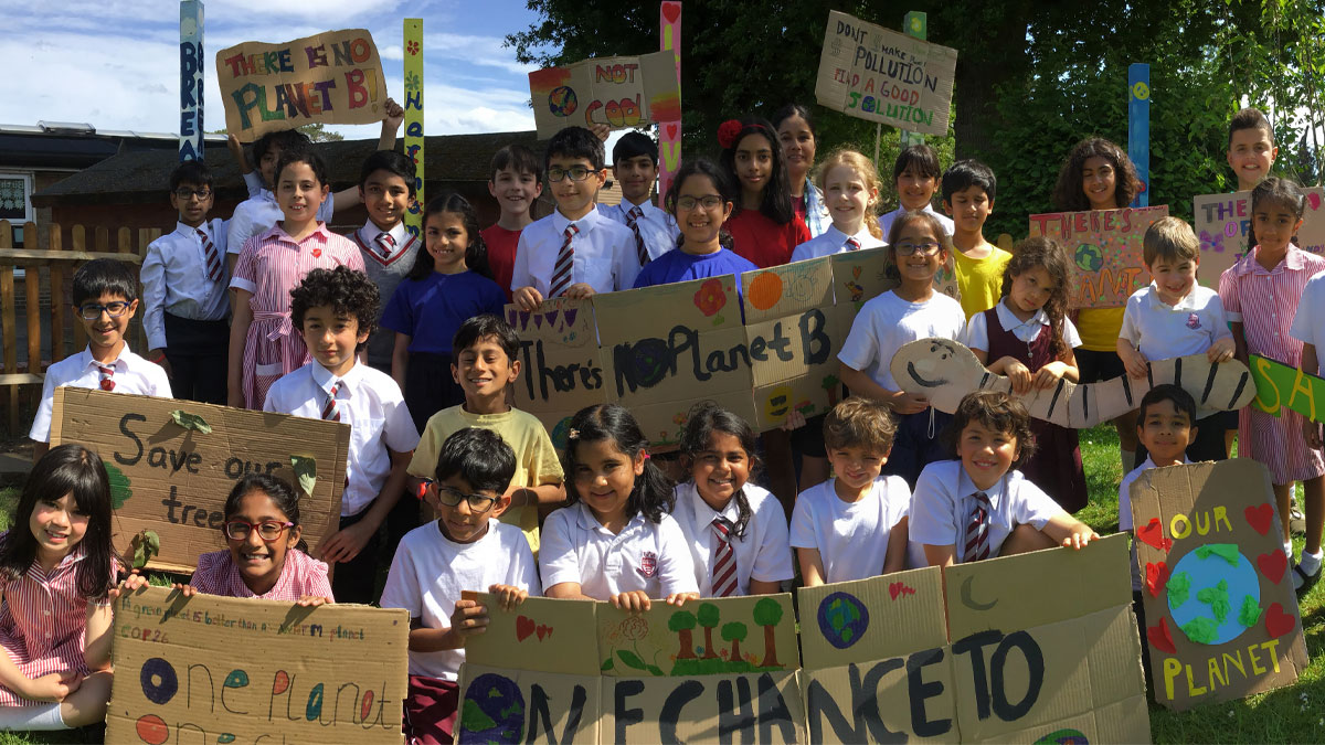 Children holding climate protest signs