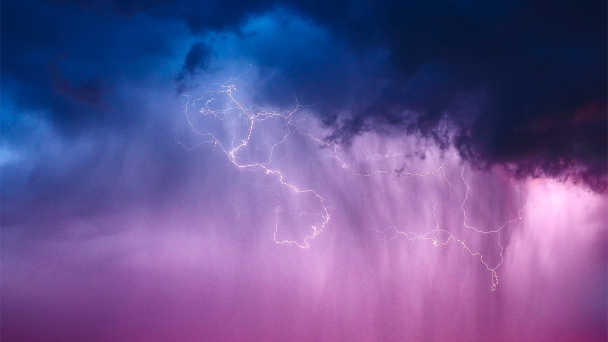 clouds with lightening, blue and purple sky.