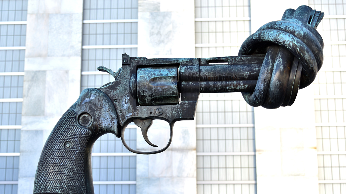 statue of a pistol with the barrel twisted into a knot