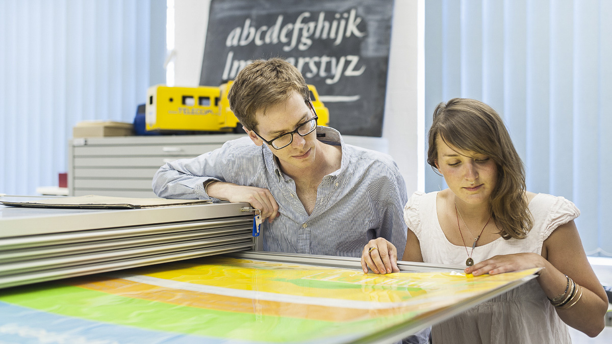 Undergraduate student and academic examine design large poster 